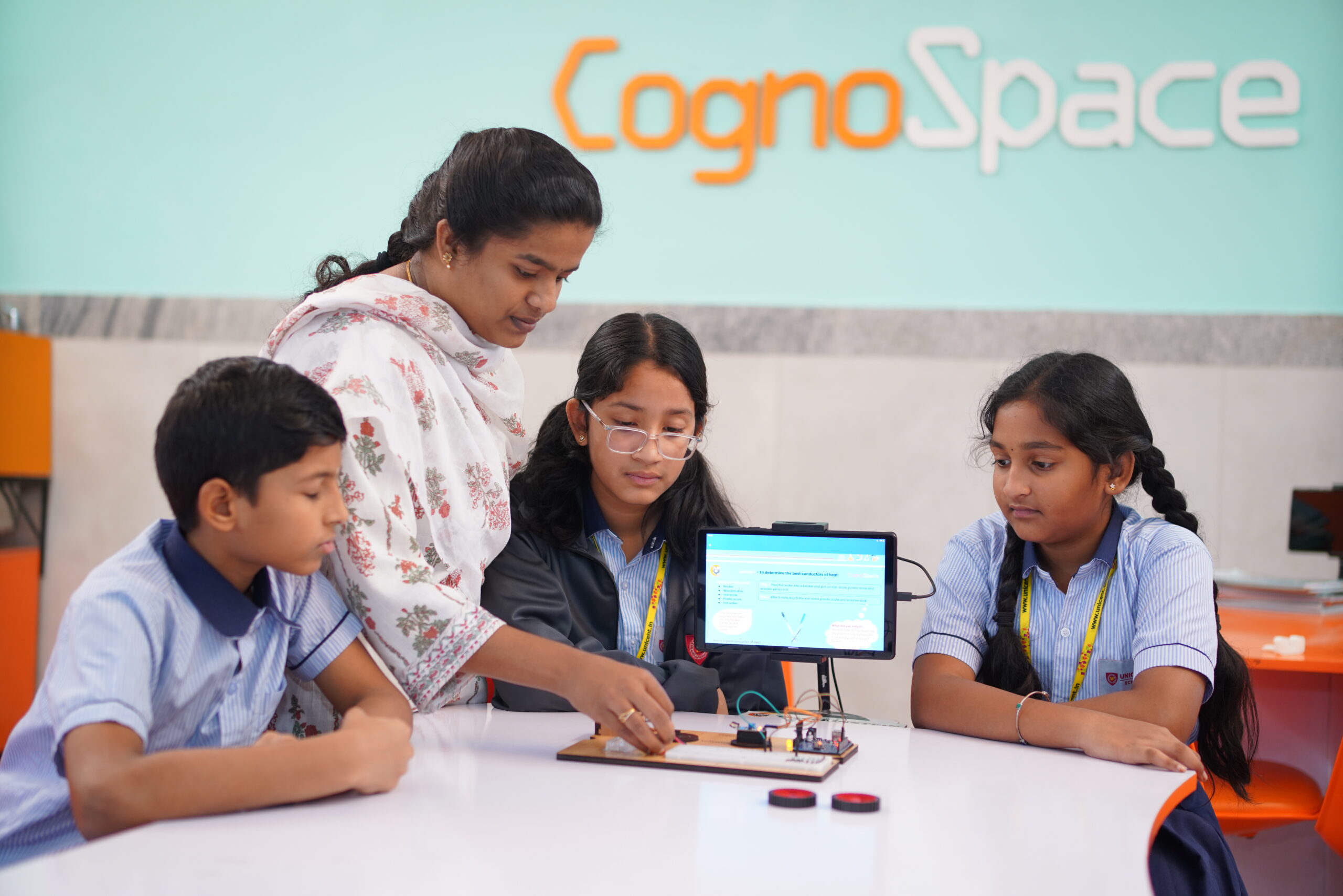 Students working on a robotics kit
