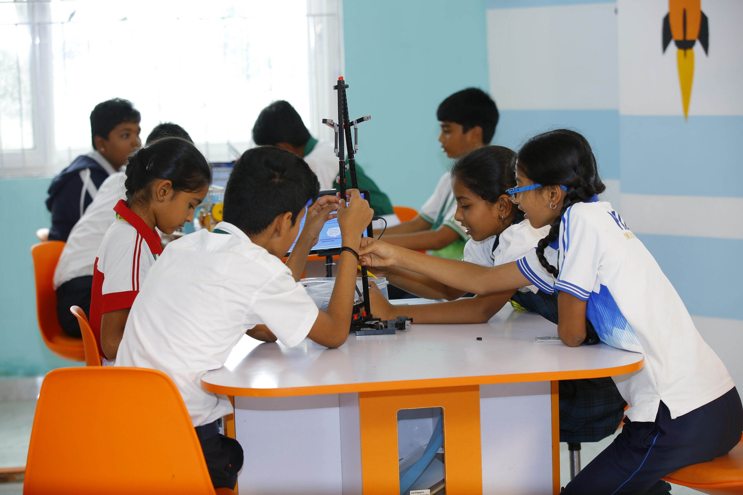 Teacher guiding a student in the lab